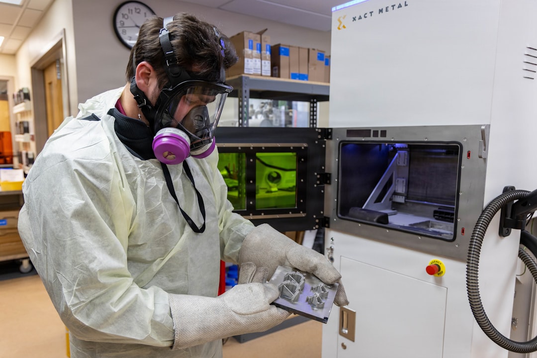 Christopher Agritellis, 3D Medical Applications Center quality engineer, inspects a platform with dental and orthodontic devices that were created using a 3D printer March 2, 2026, at Walter Reed National Military Medical Center on Naval Support Activity Bethesda, Maryland. Walter Reeds 3D MAC uses advanced imaging design software and 3D printing to create patient-specific models, surgical guides and custom implants to support clinical decision-making and improve surgical outcomes. (DOW photo by Leticia Hopkins)